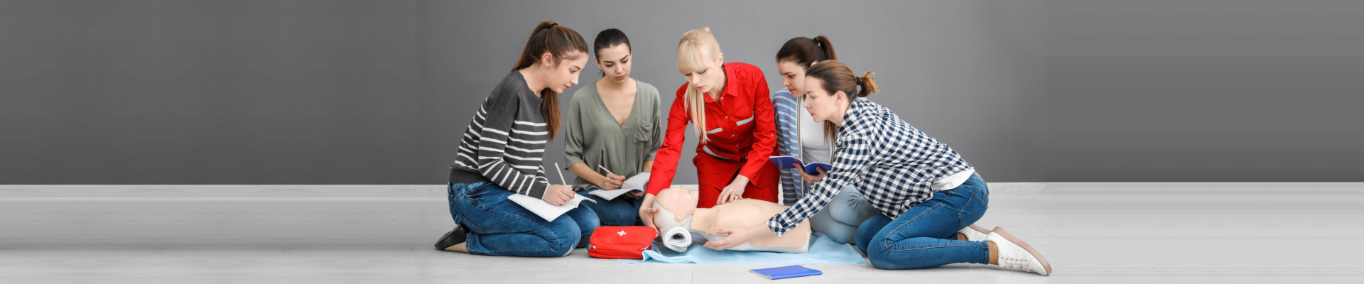 women studying CPR